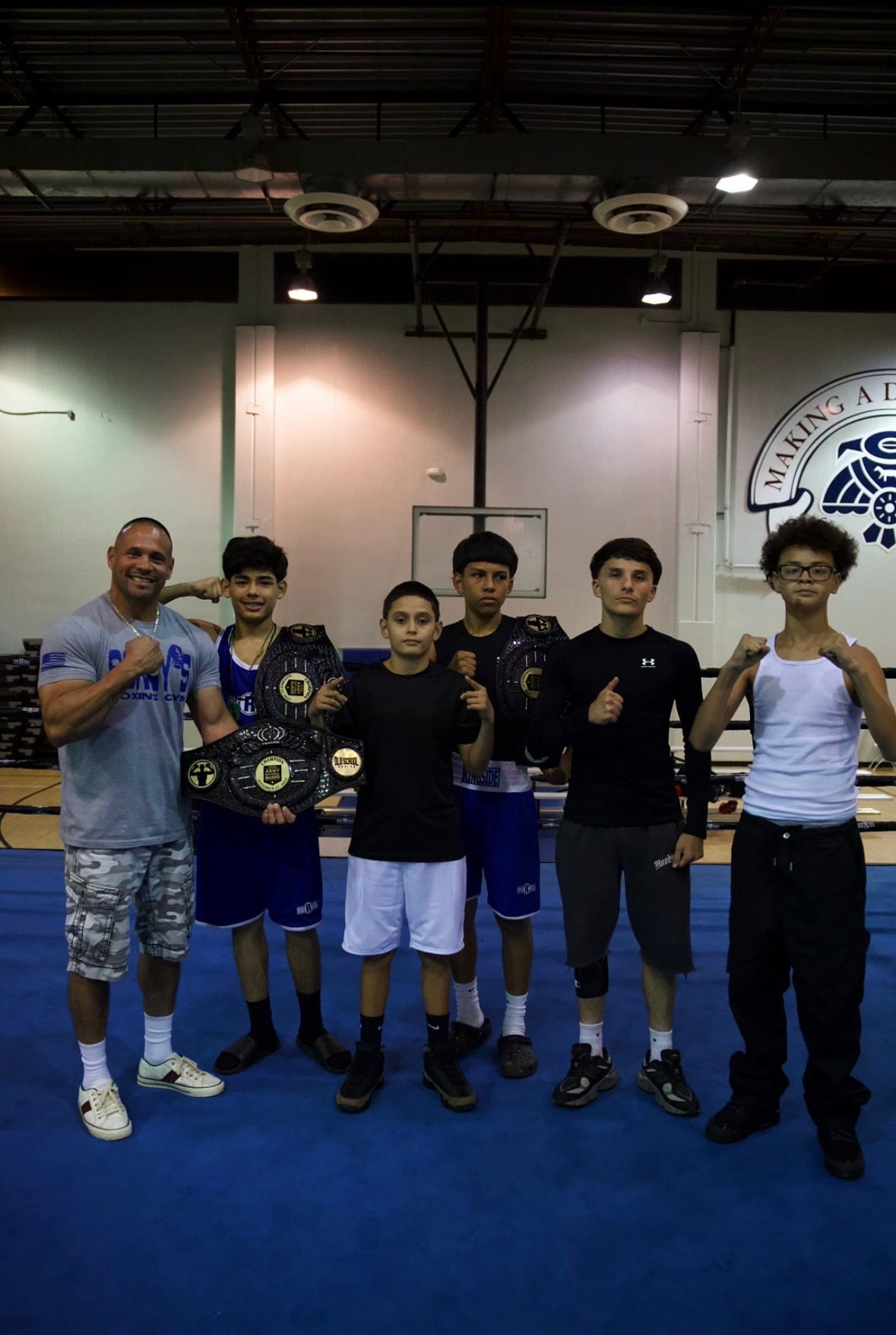 Old School Boxing Club young fighters with championship belts