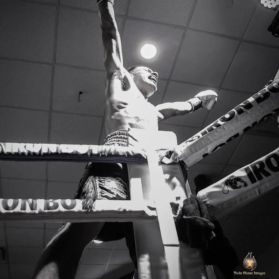 Miguel Ceballos raising his hand after the bout