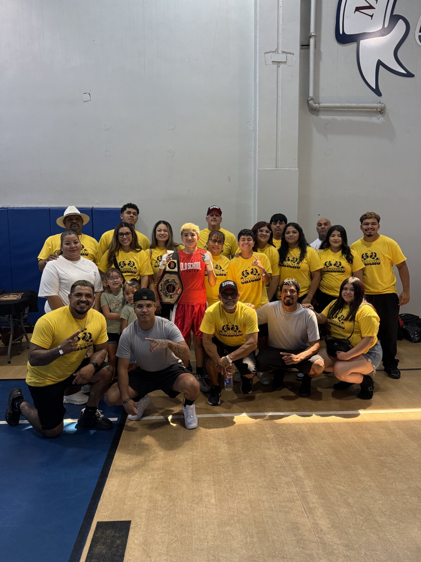 Old School Boxing team and supporters celebrating together