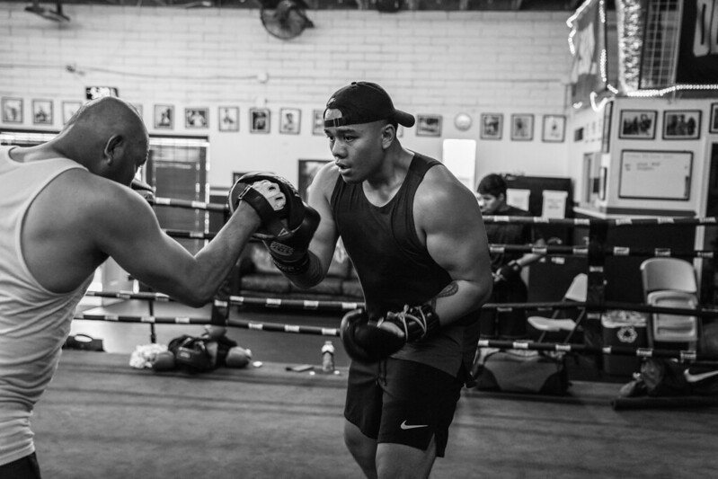 Old School Boxing Club member training on the mitts